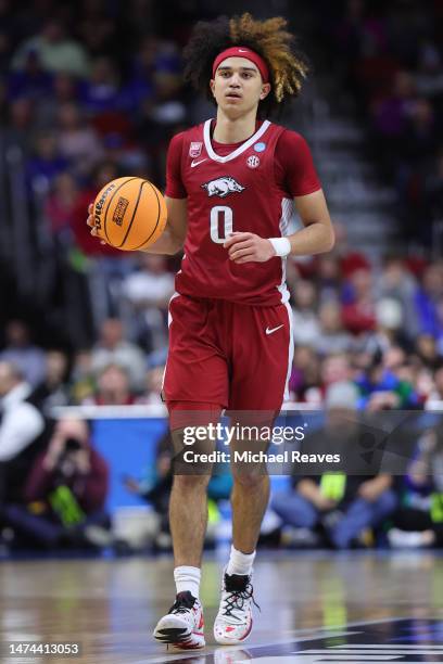 Anthony Black of the Arkansas Razorbacks dribbles the ball against the Kansas Jayhawks during the first half in the second round of the NCAA Men's...