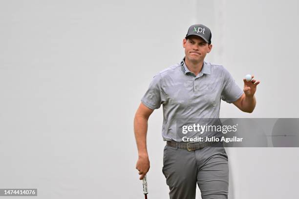 Adam Schenk of the United States waves after putting on the 18th green during the third round of the Valspar Championship at Innisbrook Resort and...