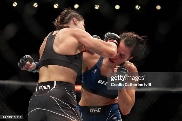 Jennifer Maia punches Casey O'Neill during the Women's Flyweight Bout between Jennifer Maia and Casey O'Neill at The O2 Arena on March 18, 2023 in...