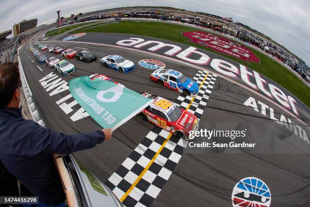 Sammy Smith, driver of the Pilot Flying J Toyota, and John Hunter Nemechek, driver of the Mobil 1 Toyota, lead the field to the green flag to start...