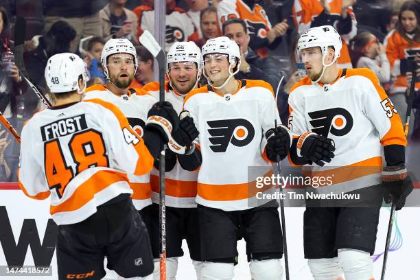Morgan Frost, Ivan Provorov, Brendan Lemieux, Tyson Foerster and Rasmus Ristolainen of the Philadelphia Flyers react following a goal by Foerster...