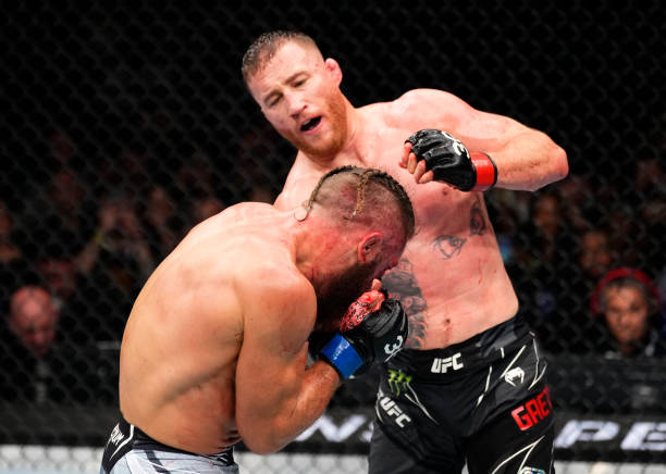 Justin Gaethje punches Rafael Fiziev of Kazakstan in a lightweight fight during the UFC 286 event at The O2 Arena on March 18, 2023 in London,...