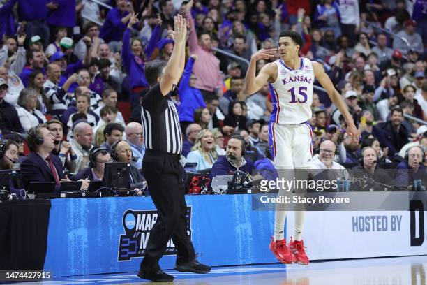 Kevin McCullar Jr. #15 of the Kansas Jayhawks reacts after his made three point basket against the Arkansas Razorbacks during the second half in the...