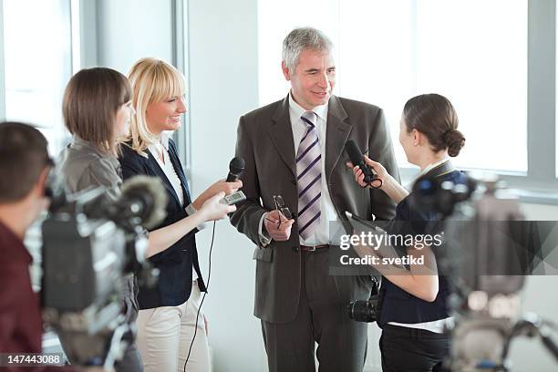 interview. - press conference cameras stock pictures, royalty-free photos & images