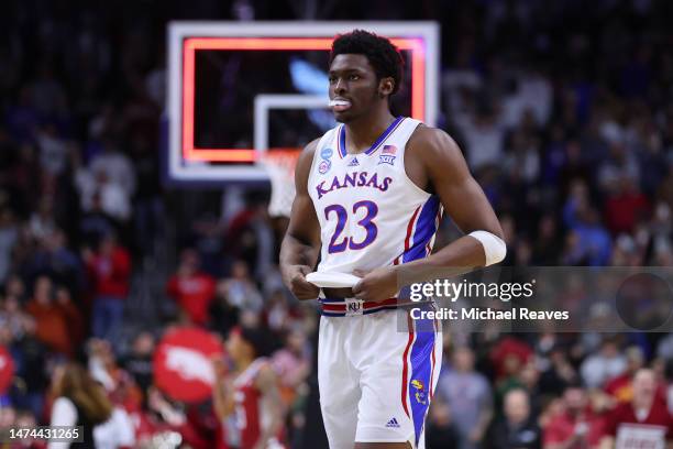 Ernest Udeh Jr. #23 of the Kansas Jayhawks reacts after being defeated by the Arkansas Razorbacks in the second round of the NCAA Men's Basketball...