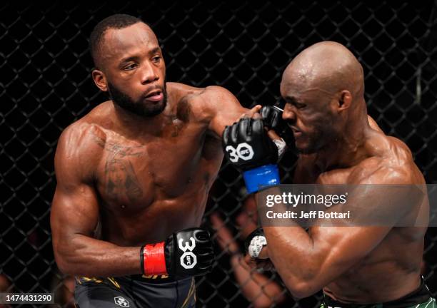 Leon Edwards of Jamaica punches Kamaru Usman of Nigeria in a lightweight fight during the UFC 286 event at The O2 Arena on March 18, 2023 in London,...