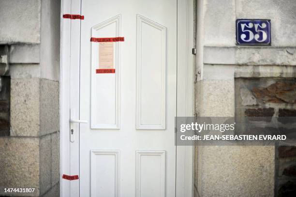 Picture taken on April 23, 2011 in the French western city of Nantes shows a police seal on the frontdoor of Dupont de Ligonnes' family home. French...