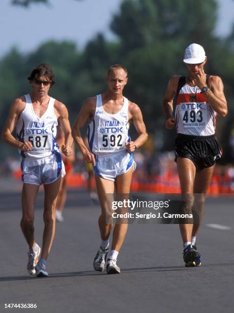 Giovanni de Benedictis of Italy, Marco Giungi of Italy and Mike Trautmann of Germany compete in the 50km Walk of the IAAF World Championships on...