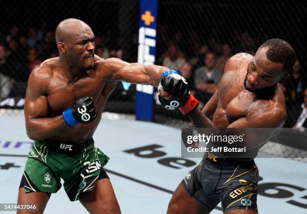 Kamaru Usman of Nigeria punches Leon Edwards of Jamaica in the UFC welterweight championship fight during the UFC 286 event at The O2 Arena on March...