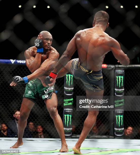 Kamaru Usman is kicked by Leon Edwards during the Welterweight Title Bout between Leon Edwards and Kamaru Usman at The O2 Arena on March 18, 2023 in...