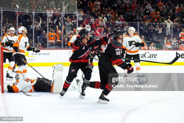 Sebastian Aho and Martin Necas of the Carolina Hurricanes celebrate a goal by Necas during the third period against the Philadelphia Flyers at Wells...
