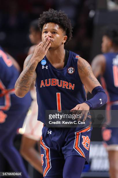 Wendell Green Jr. #1 of the Auburn Tigers reacts after making a three-point basket during the first half against the Houston Cougars in the second...