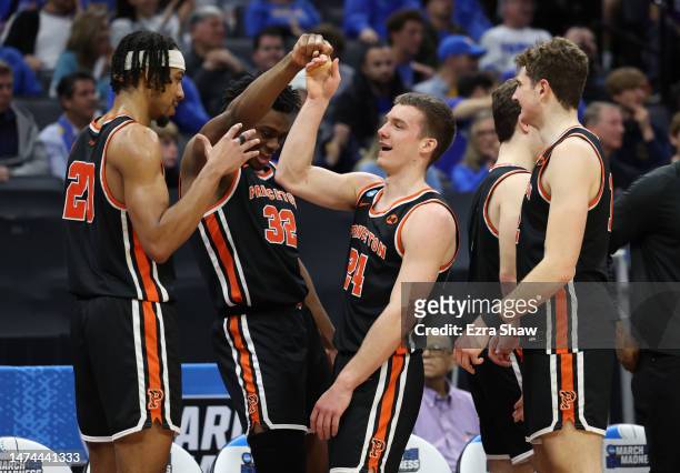 Blake Peters, Tosan Evbuomwan, and Keeshawn Kellman of the Princeton Tigers react on the bench during the second half against the Missouri Tigers in...