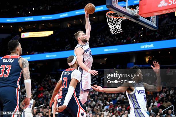 Domantas Sabonis of the Sacramento Kings dunks the ball in the second quarter of the game against the Washington Wizards at Capital One Arena on...