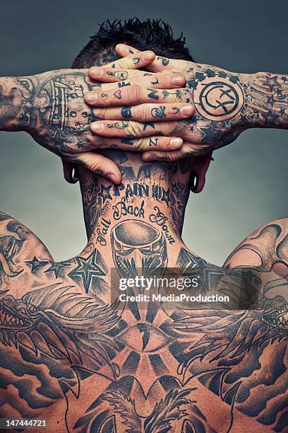 tattoo artist back - tattoo man stock pictures, royalty-free photos & images