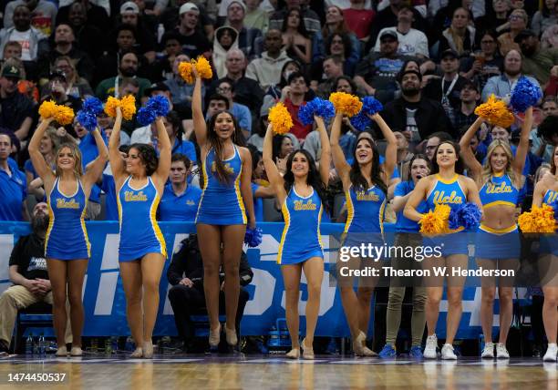 The UCLA Bruins cheerleaders perform during the first half against the Northwestern Wildcats in the second round of the NCAA Men's Basketball...