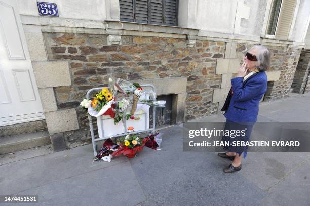 Woman medidates in front of Dupont de Ligonnes' family home on April 23, 2011 in French western city of Nantes where local people have begun leaving...