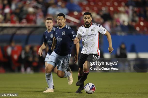 Sebastian Lletget of FC Dallas is marked by Roger Espinoza of Sporting Kansas City during the MLS game between Sporting Kansas City and FC Dallas at...