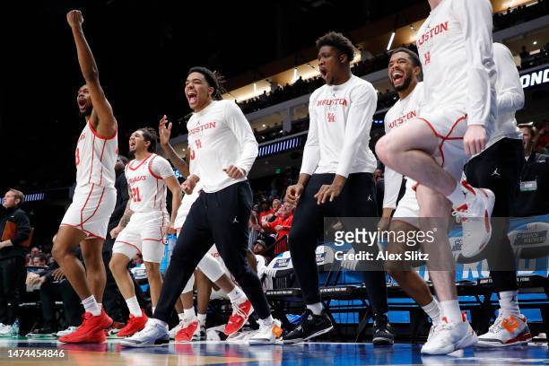 The Houston Cougars bench celebrates during the second half against the Auburn Tigers in the second round of the NCAA Men's Basketball Tournament at...