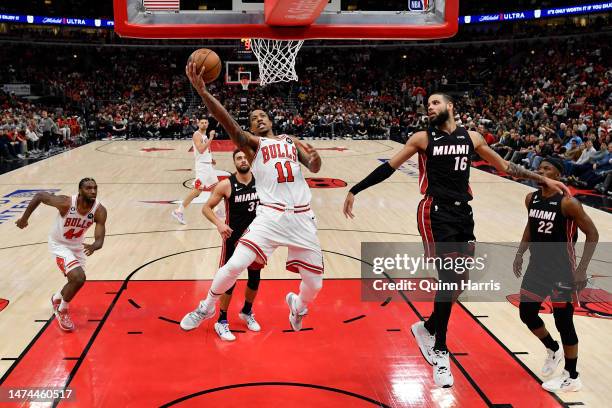 DeMar DeRozan of the Chicago Bulls shoots against Caleb Martin of the Miami Heat during the second half of the game at United Center on March 18,...