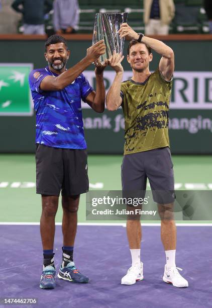 Rohan Bopanna of India and Matthew Ebden of Australia celebrate with the winners trophy after defeating Wesley Koolhof of Netherlands and Neal...