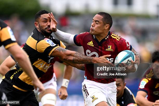 Aaron Smith of the Highlanders fends Toni Pulu of the Force during the round four Super Rugby Pacific match between Highlanders and Western Force at...