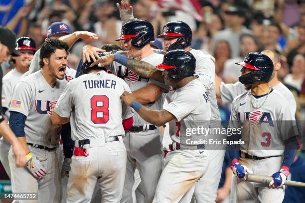 Trea Turner of The United States celebrates with teammates after hitting a grand slam during the eighth inning of a 2023 World Baseball Classic...