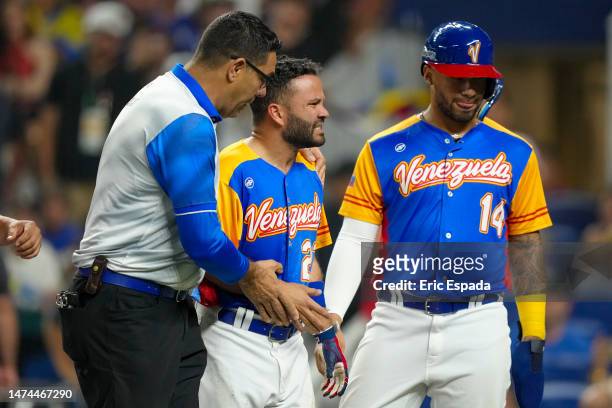 Jose Altuve of Venezuela walks towards the dugout after being hit by a pitch during the fifth inning during a 2023 World Baseball Classic...