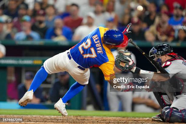 Jose Altuve of Venezuela is hit by a pitch during the fifth inning during a 2023 World Baseball Classic Quarterfinal game against the United States...