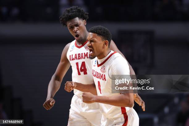 Noah Gurley of the Alabama Crimson Tide celebrates with Charles Bediako after scoring a basket during the second half against the Maryland Terrapins...