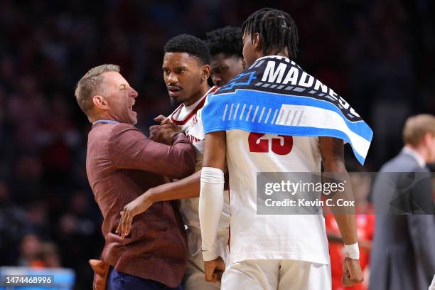 Noah Gurley of the Alabama Crimson Tide celebrates with head coach Nate Oats after scoring a basket during the second half against the Maryland...