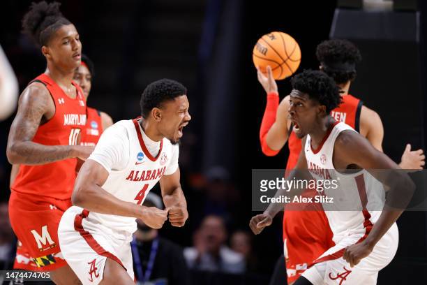 Noah Gurley of the Alabama Crimson Tide and Charles Bediako react during the second half against the Maryland Terrapins in the second round of the...