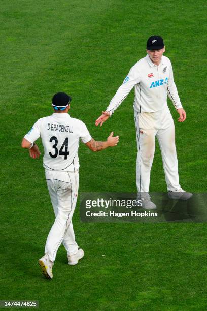 Doug Bracewell and Michael Bracewell of New Zealand talk during day three of the Second Test Match between New Zealand and Sri Lanka at Basin Reserve...