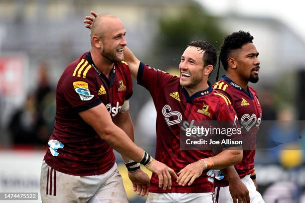 Hugh Renton celebrates with Mitch Hunt of the Highlanders after scoring a try during the round four Super Rugby Pacific match between Highlanders and...