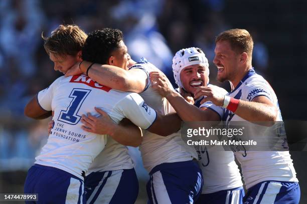 Hayze Perham of the Bulldogs celebrates scoring a try with team mates during the round three NRL match between Canterbury Bulldogs and Wests Tigers...