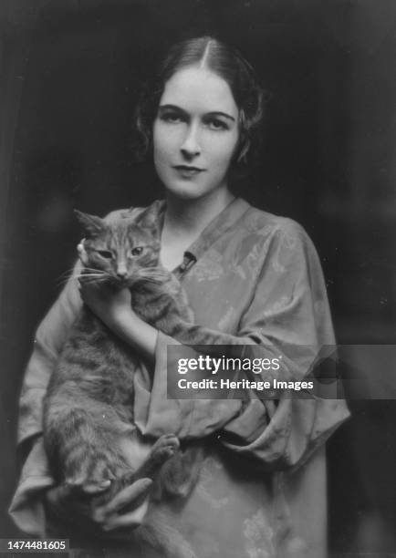 Pujo, Mona, Miss, with Buzzer the cat, portrait photograph, 1916. Creator: Arnold Genthe.