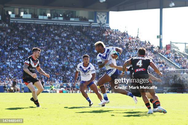 Viliame Kikau of the Bulldogs makes a break during the round three NRL match between Canterbury Bulldogs and Wests Tigers at Belmore Sports Ground on...