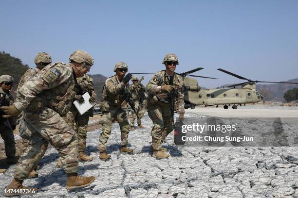 Soldiers from the 2nd Infantry Division participate in a field artillery battalion gun raid exercise as a part of joint Freedom Shield exercise with...