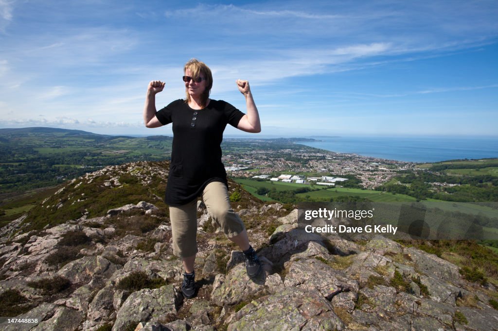 Woman standing on a mountain