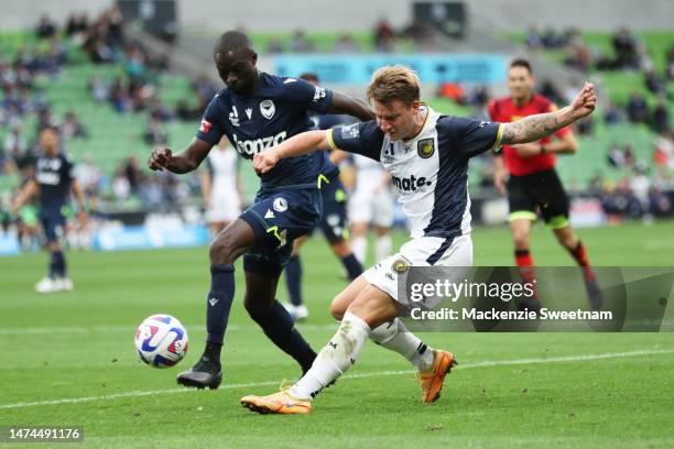 James McGarry of the Central Coast Mariners competes for the ball against Jason Geria of the Victory during the round 21 A-League Men's match between...