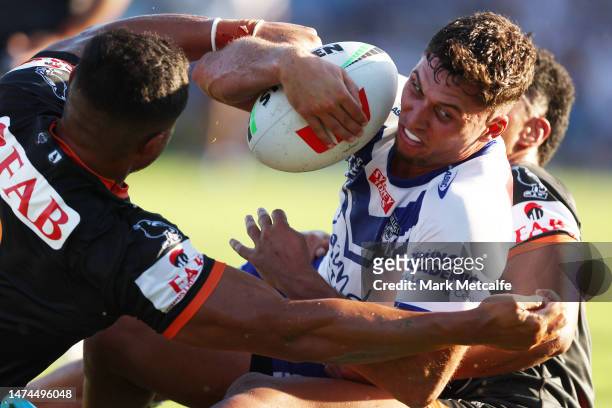 Kyle Flanagan of the Bulldogs is tackled short of the line during the round three NRL match between Canterbury Bulldogs and Wests Tigers at Belmore...