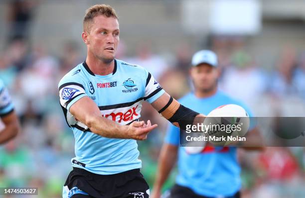 Matt Moylan of the Sharks passes during the round three NRL match between Canberra Raiders and Cronulla Sharks at GIO Stadium on March 19, 2023 in...