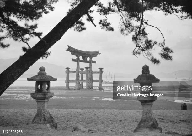 Travel views of Japan and Korea, 1908. Photo shows the famous "floating torii" at Itsukushima Shrine in Miyajima, Japan. Creator: Arnold Genthe.