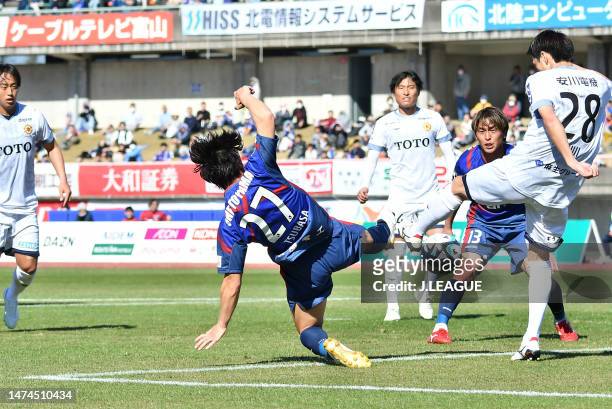 Players tussle during the J.LEAGUE Meiji Yasuda J3 3rd Sec. Match between Kataller Toyama and Giravanz Kitakyushu at Toyama Stadium on March 19, 2023...