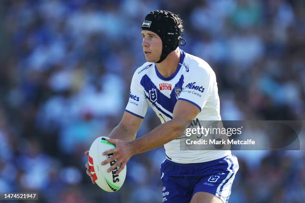 Matt Burton of the Bulldogs looks to kick during the round three NRL match between Canterbury Bulldogs and Wests Tigers at Belmore Sports Ground on...