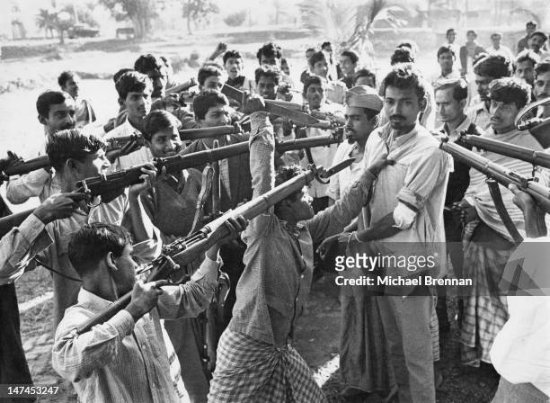 Freedom fighters with captured informer Razakhar, after the Indian Army liberated Jessore in Bangladesh, then part of East Pakistan, circa 1971.