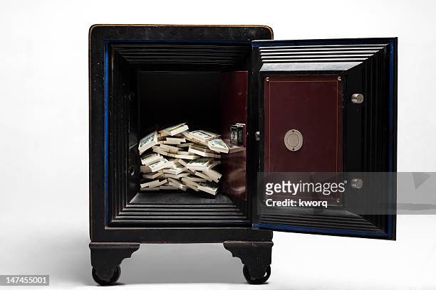 open safe with stacks of cash - money safe stock pictures, royalty-free photos & images