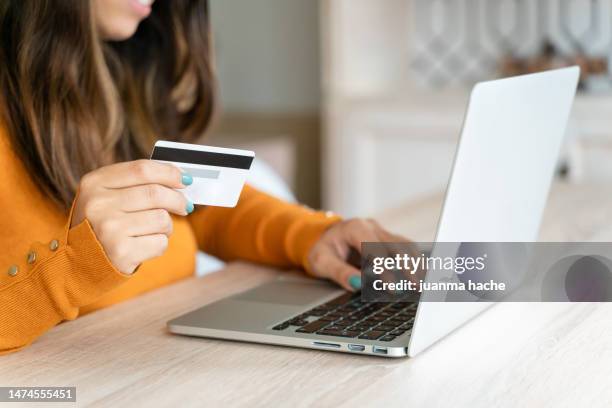 crop woman using laptop at home - public phone charging stock pictures, royalty-free photos & images