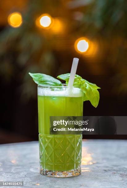 gin basil smash summer cocktail drink glass aperitif at outdoor garden party - cucumber cocktail stock pictures, royalty-free photos & images