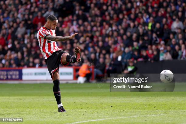 Max Lowe of Sheffield United takes a shot before deflecting from Sam Gallagher of Blackburn Rovers, leading to Sheffield United's first goal during...